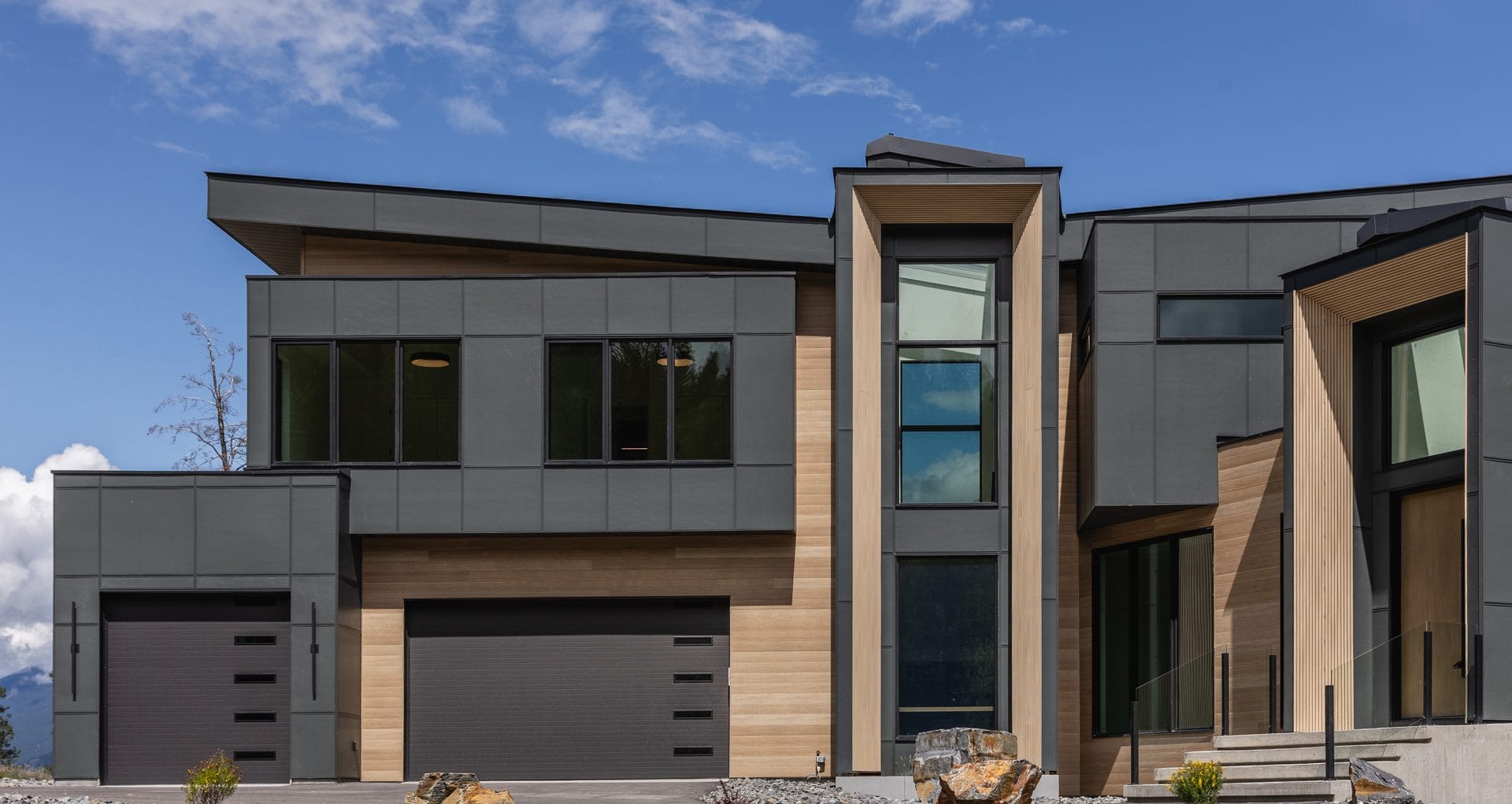 Exterior of a West Ridge home showing the full building envelope on site