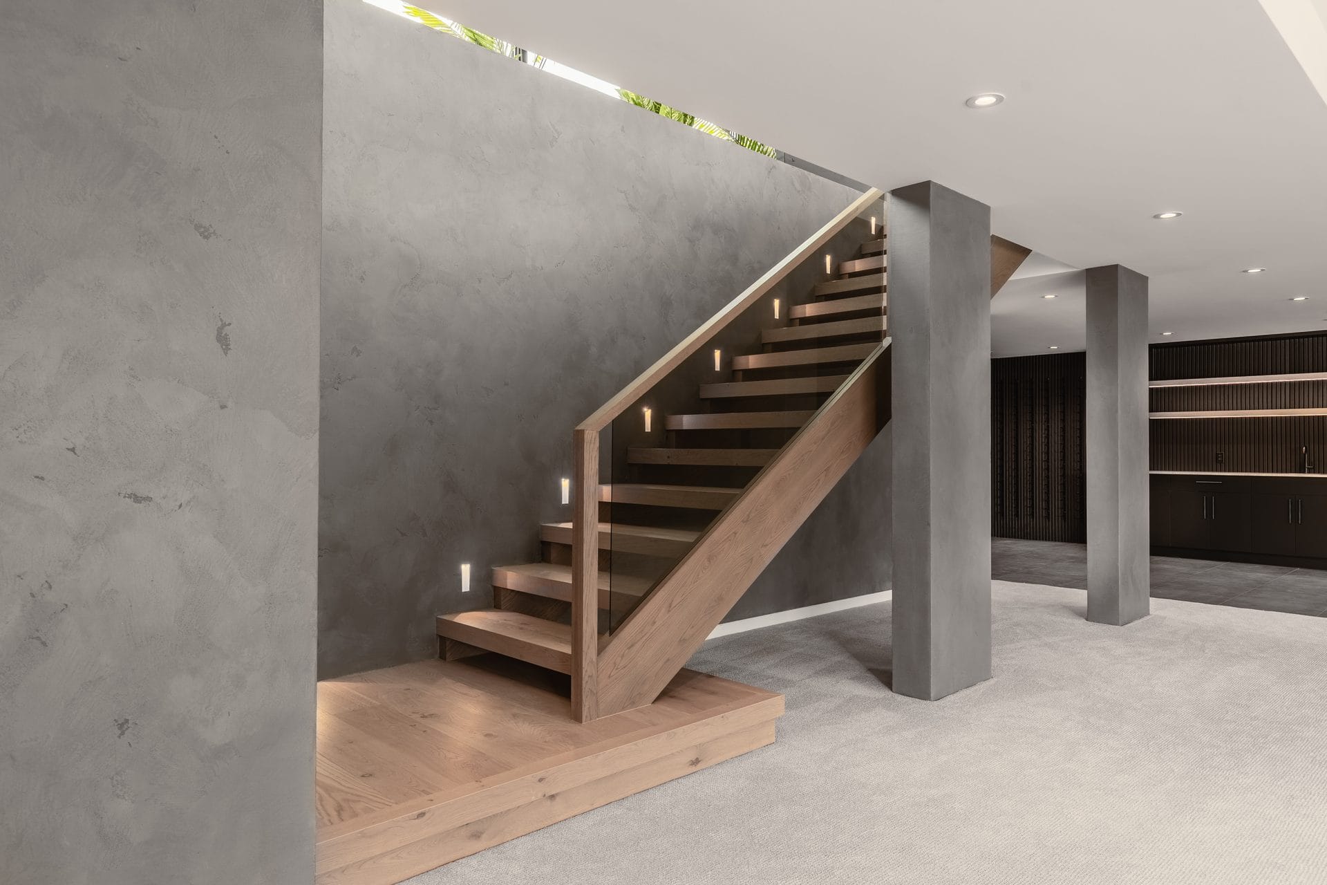 Concrete stair with wood treads and glass guard at Springwater Hill