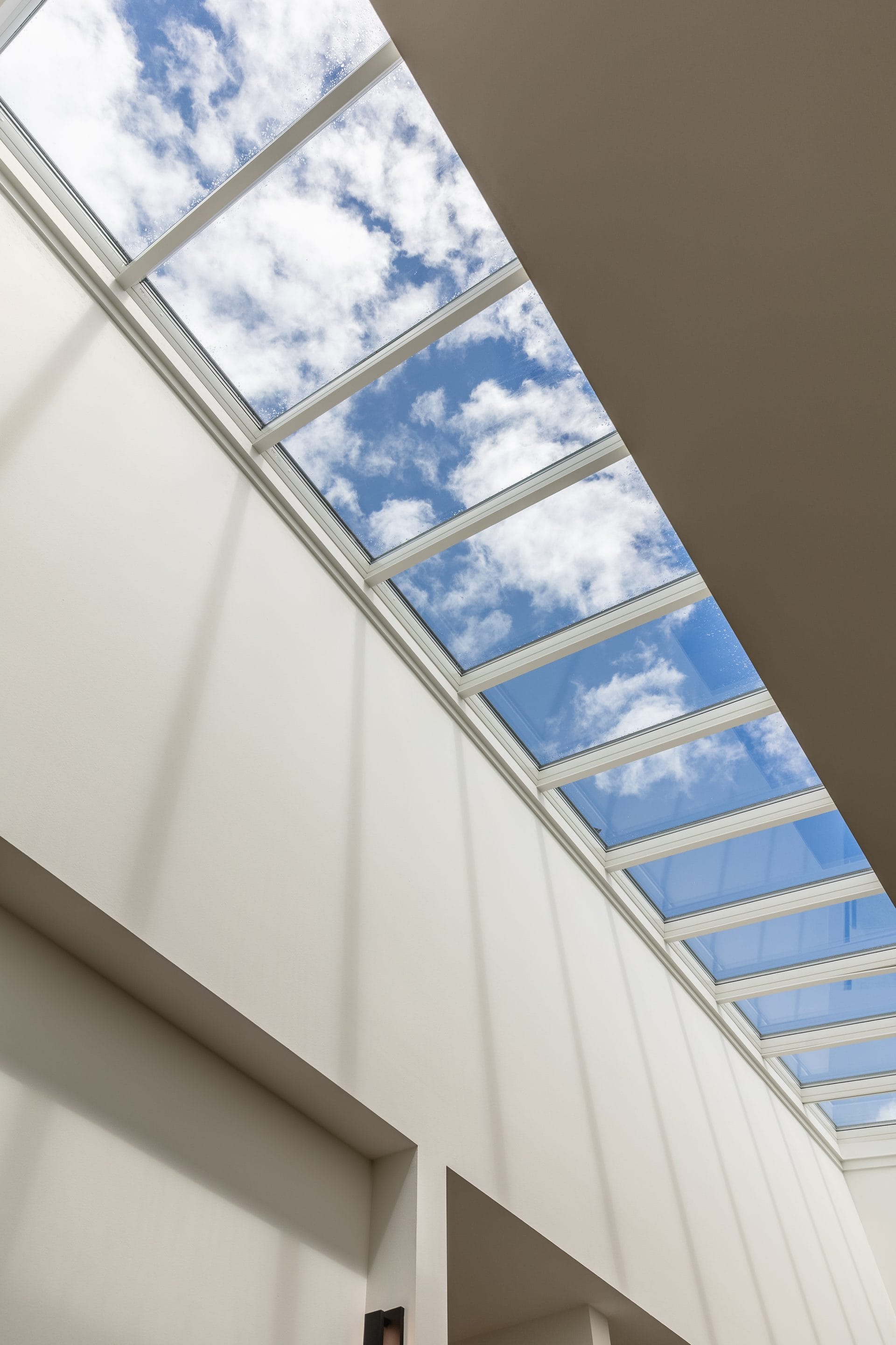 Skylight column drawing light down through Springwater Hill