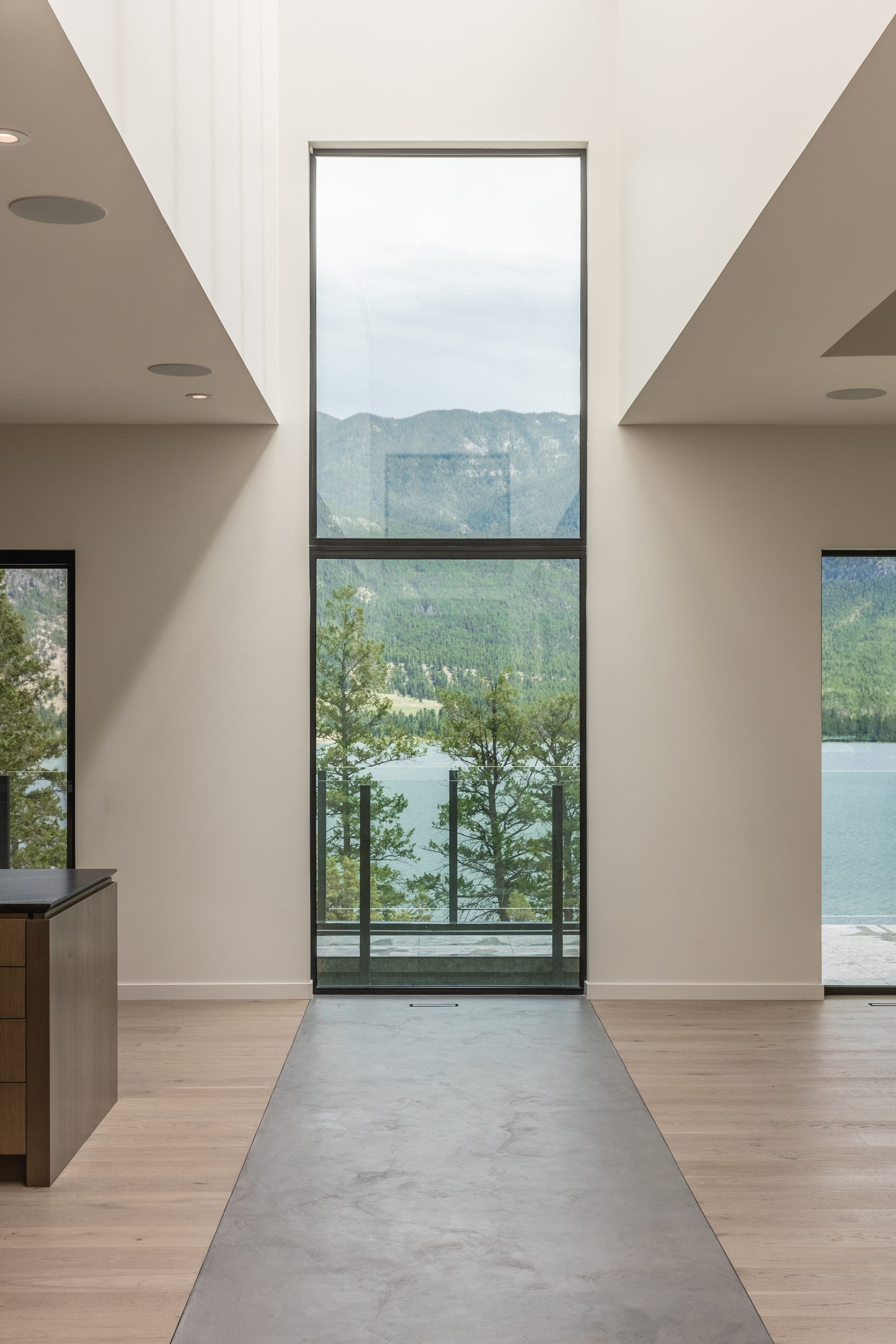 Floor to ceiling glazing framing the mountain view at Springwater Hill