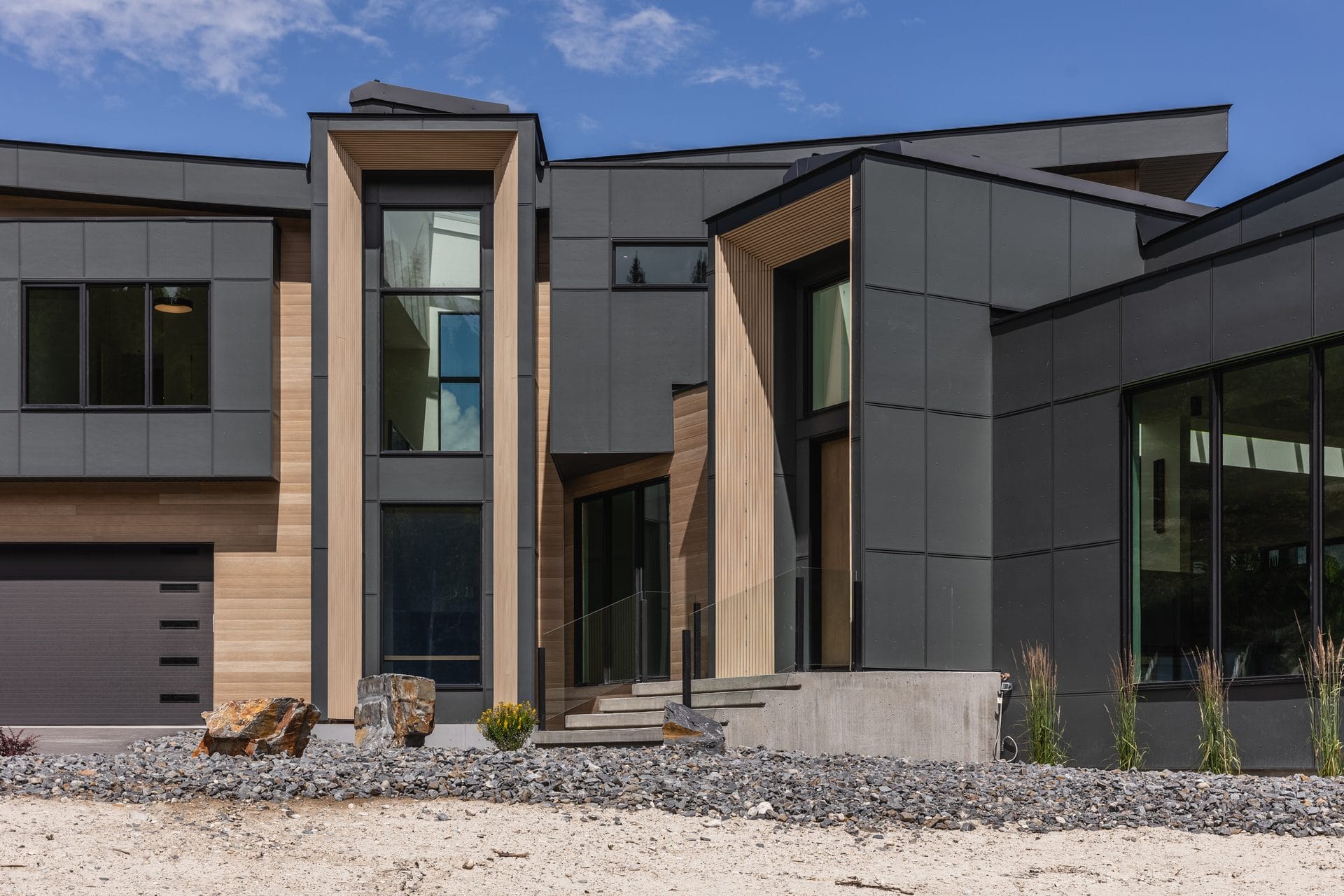 Roofline, glazing and cladding meeting at a corner of Springwater Hill