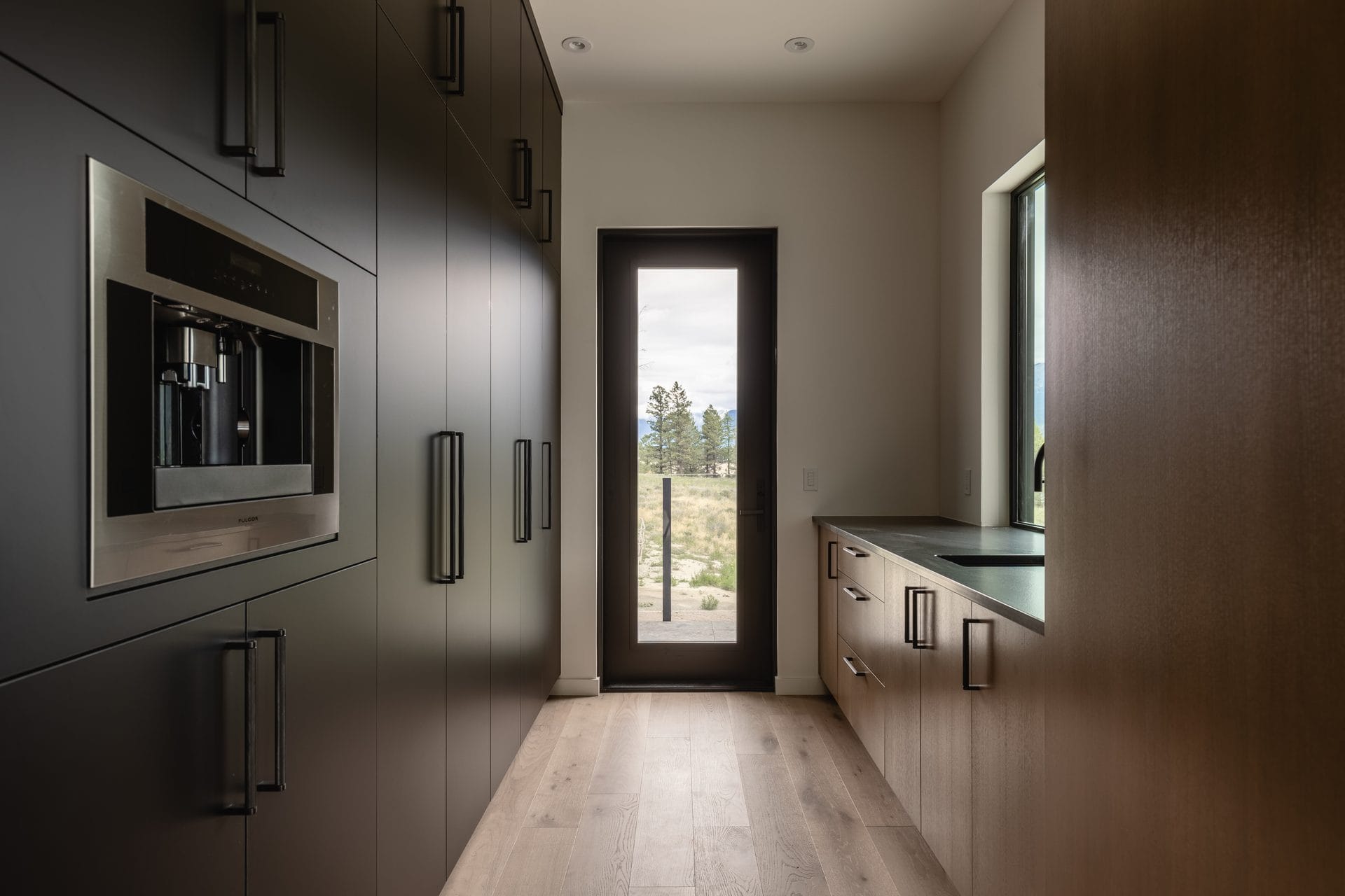 Built-in coffee station in the mudroom corridor at Springwater Hill
